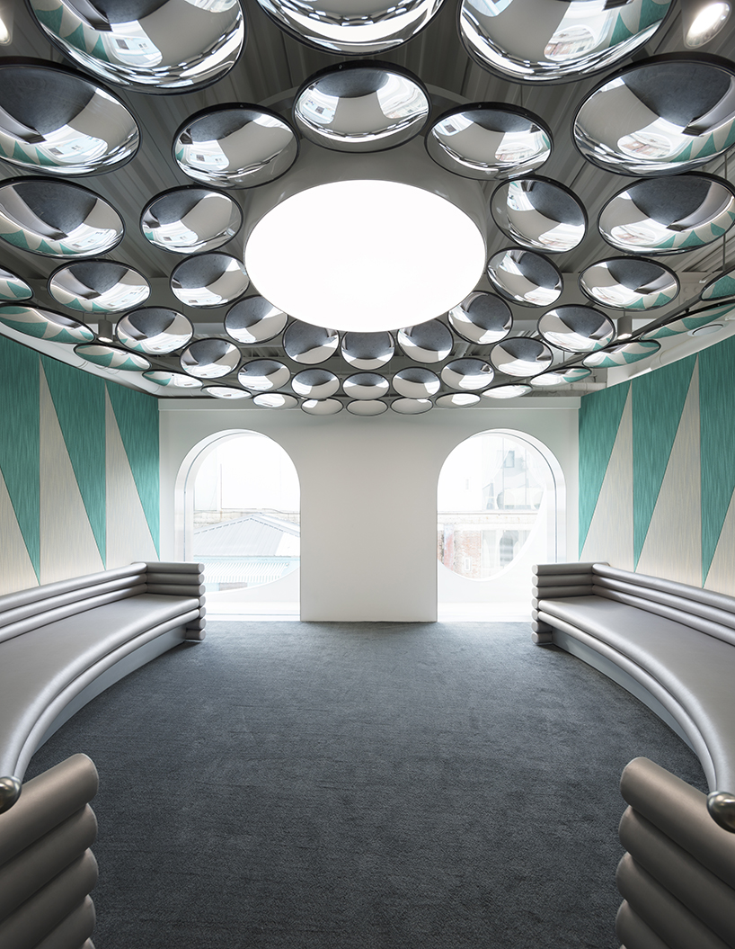 123 architects applies an arched silver façade to photography studio in beijing - 9