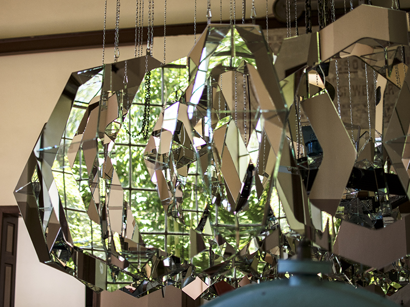 thomas medicus suspends turbine-shaped glass installation at hydropower plant in austria