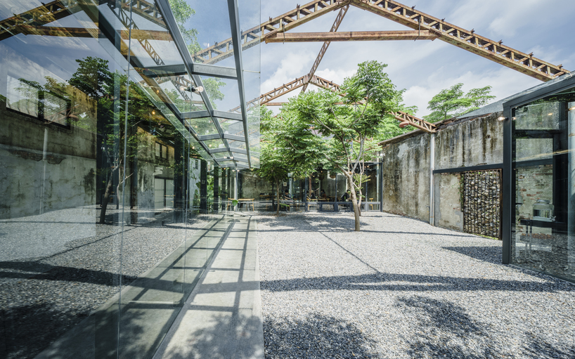 studio apl creates stone courtyard life in 80 years grain bin 1