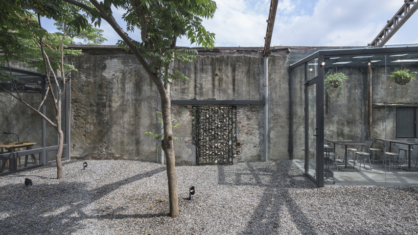 studio apl creates stone courtyard life in 80 years grain bin 5