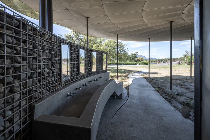 lotus garden a waterside ecological cycling station with metal lotus leaves floating in dapo pond taiwan 4