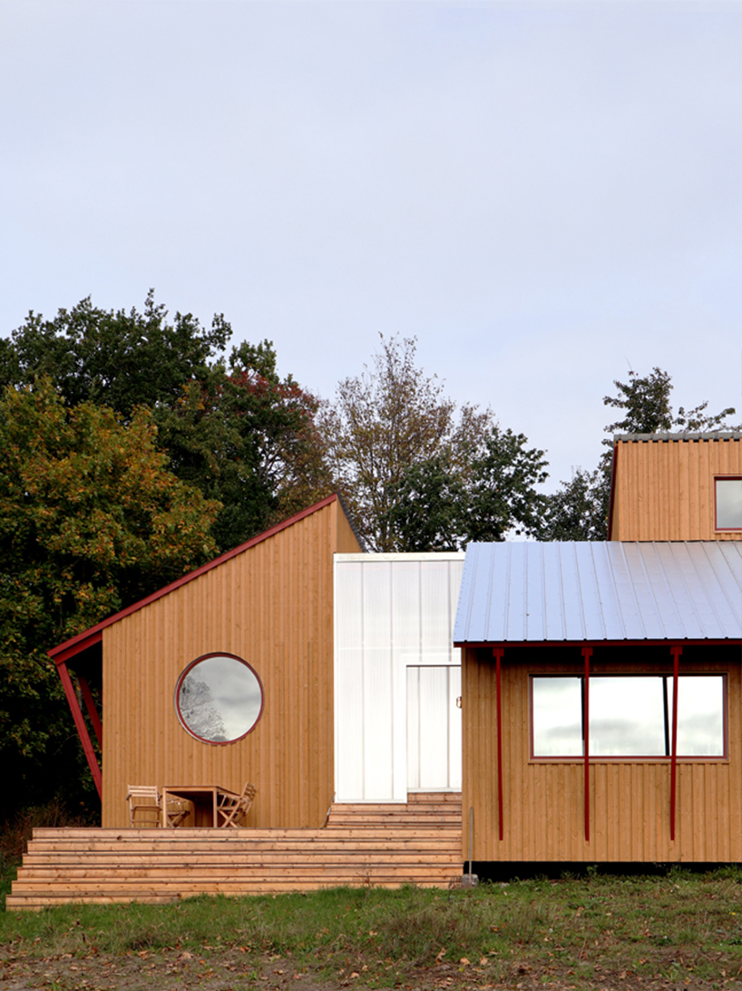 arcgency's 'house on the hill' is a sustainable addition to a school in rural denmark
