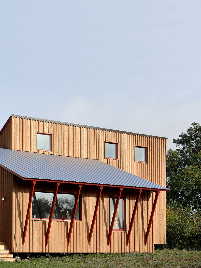 arcgency's 'house on the hill' is a sustainable addition to a school in rural denmark