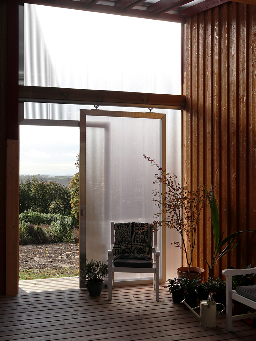 arcgency's 'house on the hill' is a sustainable addition to a school in rural denmark