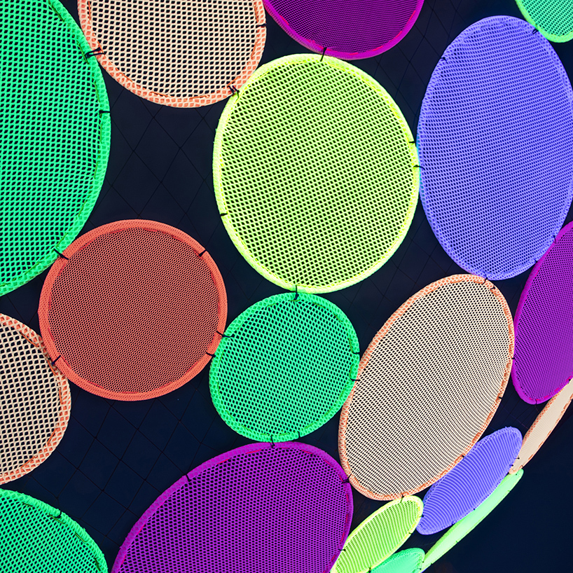 hou de sousa suspends the multi-colored 'atomic' installation in georgetown DC designboom