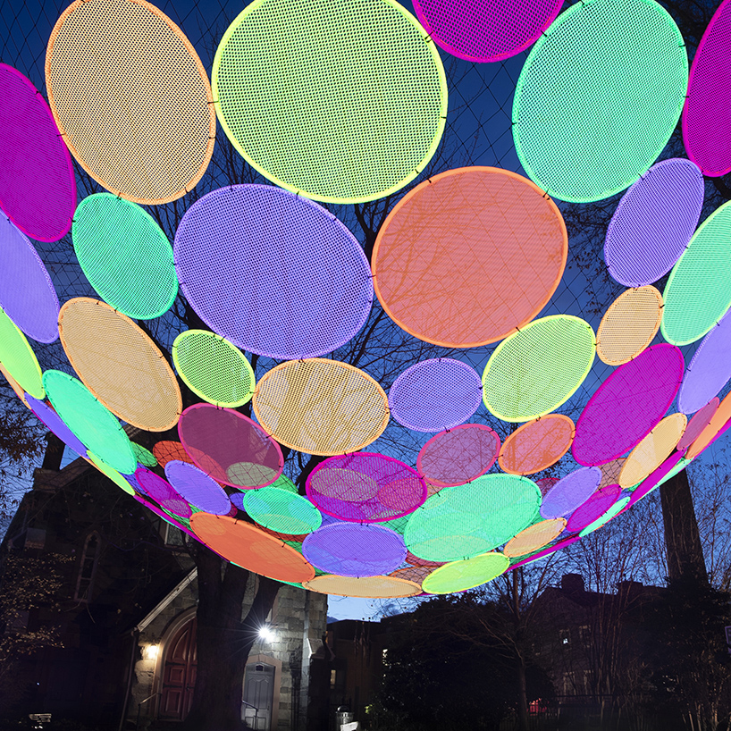 hou de sousa suspends the multi-colored 'atomic' installation in georgetown DC designboom