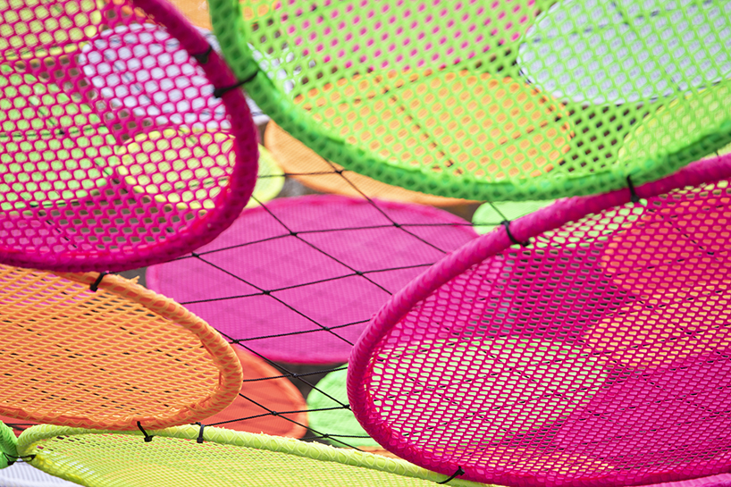 hou de sousa suspends the multi-colored 'atomic' installation in georgetown DC designboom