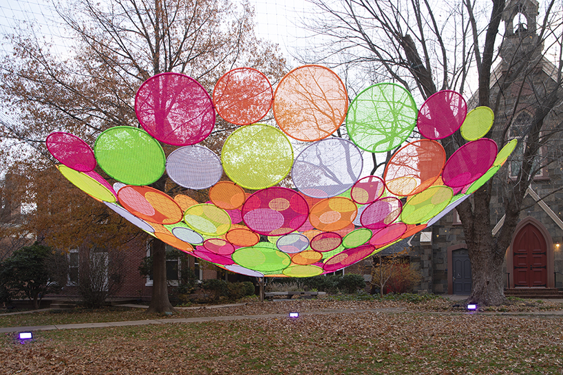 hou de sousa suspends the multi-colored 'atomic' installation in georgetown DC designboom