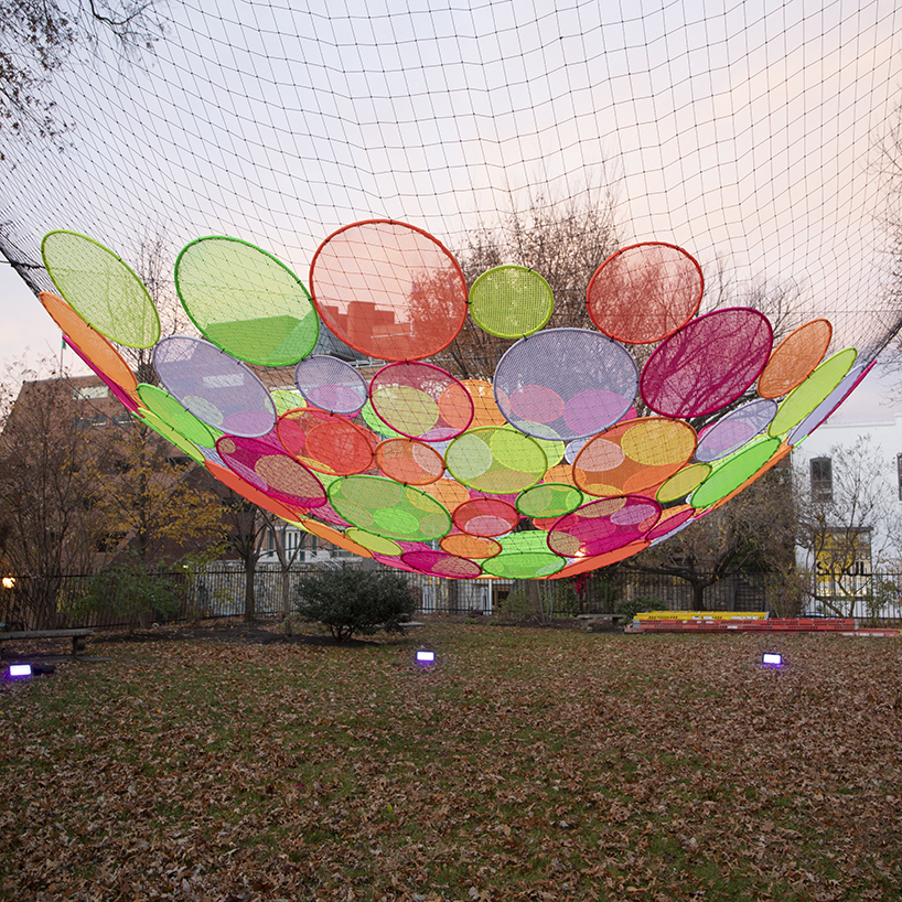 hou de sousa suspends the multi-colored 'atomic' installation in georgetown DC designboom