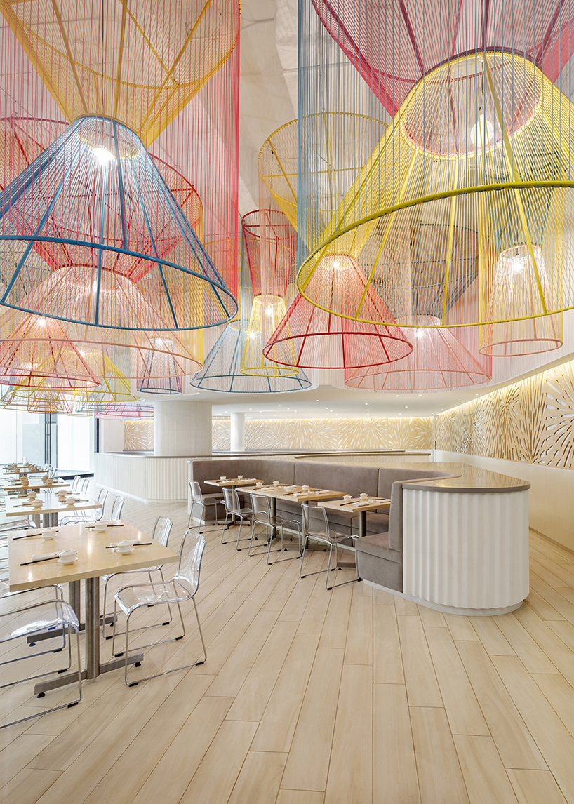 colorful lanterns float above quito restaurant designed by hou de sousa 1