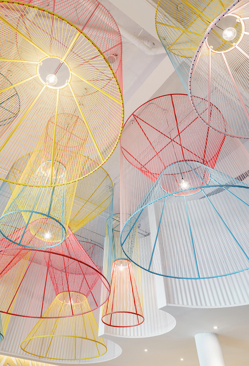 colorful lanterns float above quito restaurant designed by hou de sousa 12