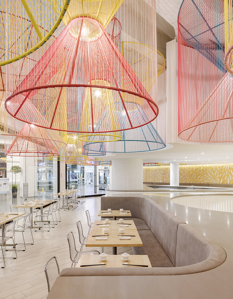 colorful lanterns float above quito restaurant designed by hou de sousa 3