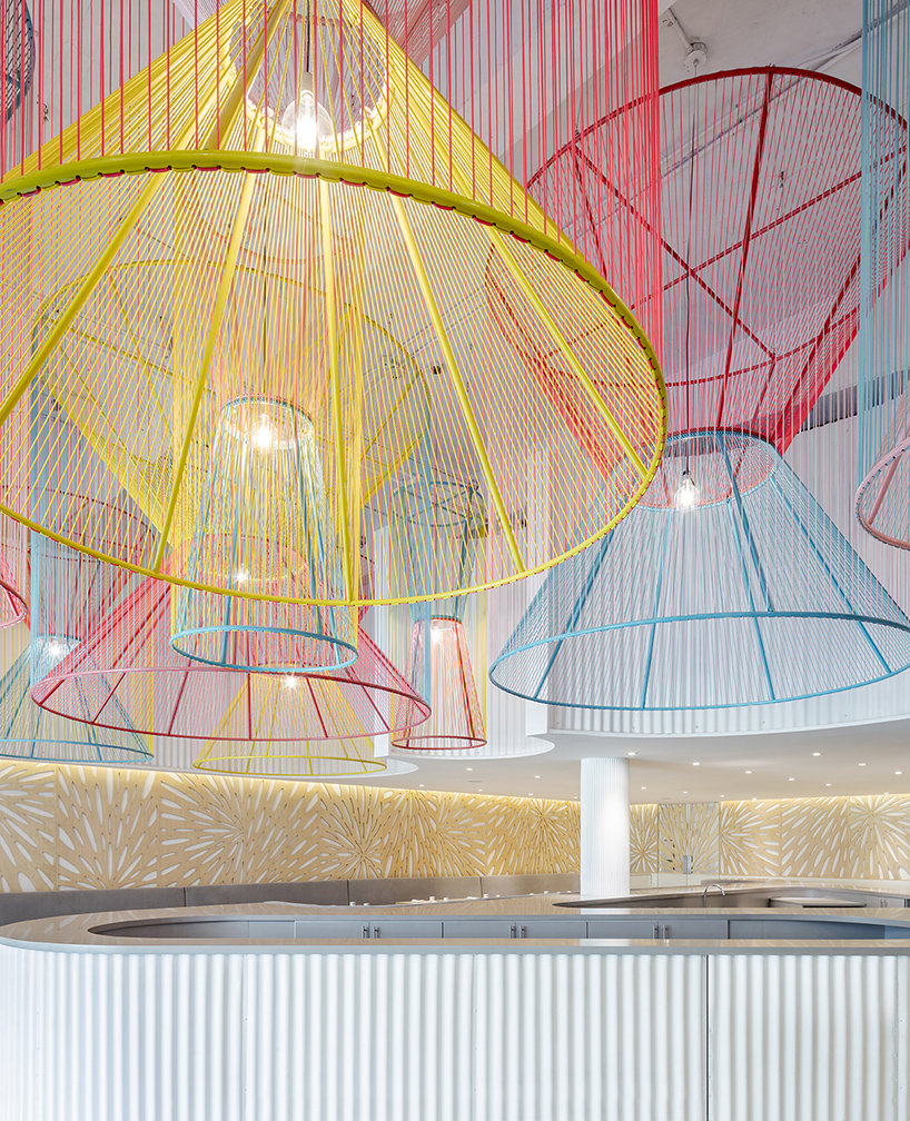 colorful lanterns float above quito restaurant designed by hou de sousa 6