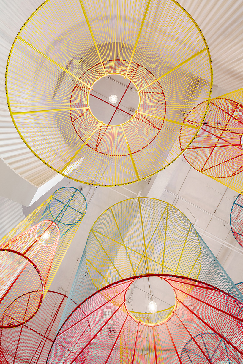 colorful lanterns float above quito restaurant designed by hou de sousa 9
