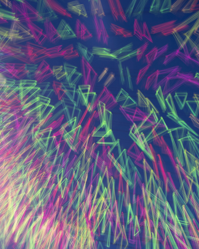 hou de sousa suspends a canopy of neon triangles over detroit designboom