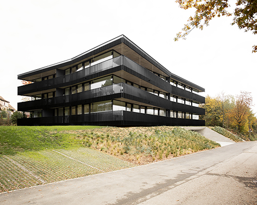 apartment building by FHV floats with concentric, rectangular rings