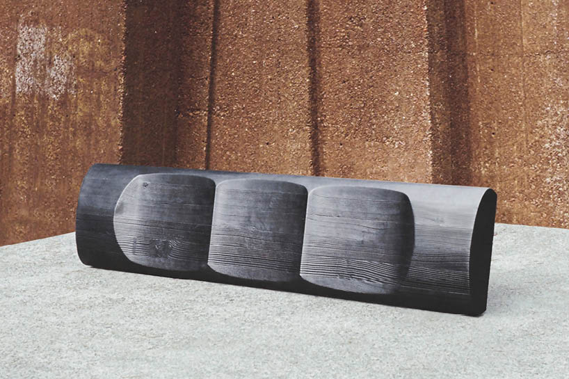ákos huber carves reclaimed wood into monolithic bench reminiscent of native totem poles