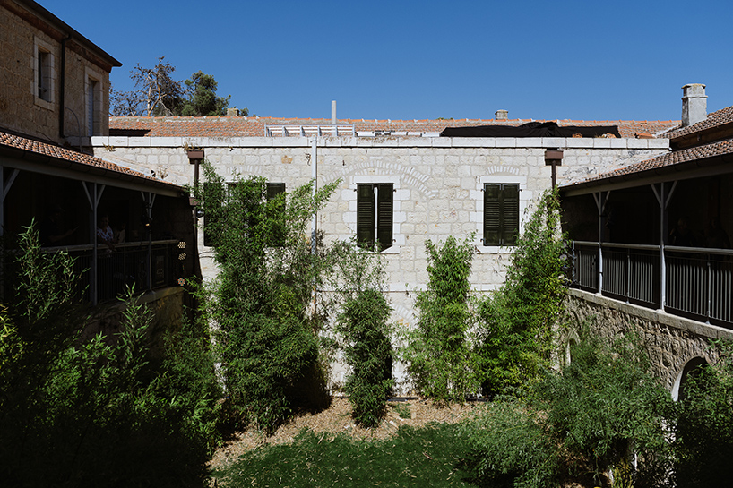 organic and artificial installation at jerusalem design week poses a thriving urban garden