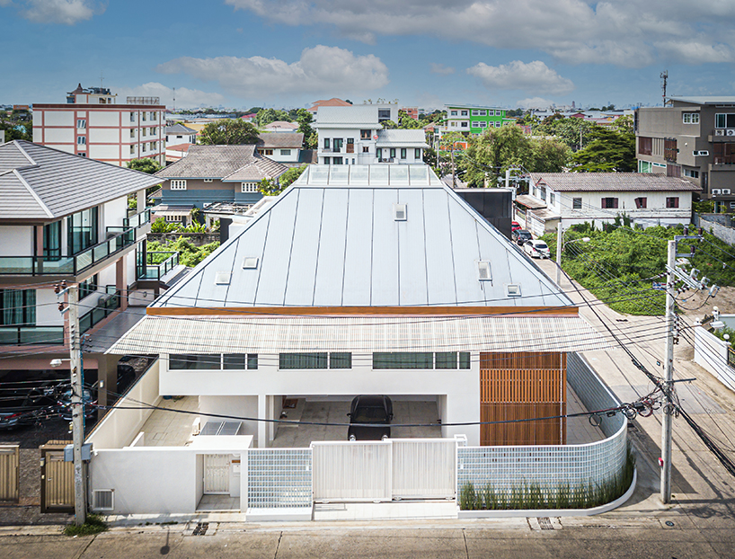 permeable lattice facade & translucent elements envelop bangkok residence by junsekino