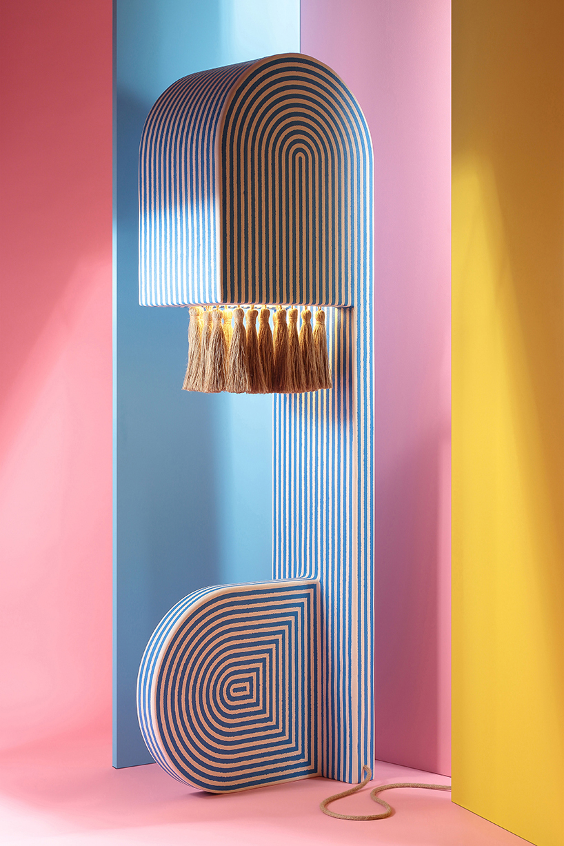 richard yasmine's lamps intertwine sleek architectural lines with organic jute textures