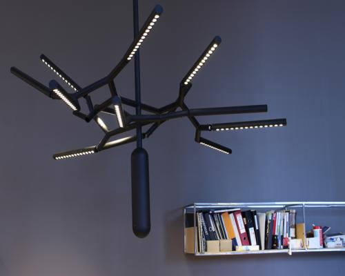 branch chandelier mimics tree boughs via linear aluminum tubes