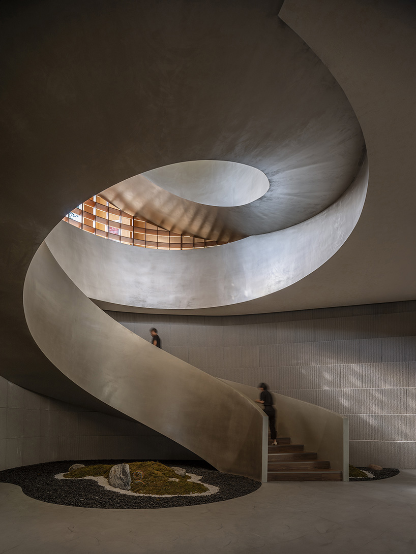 archstudio weaves resort exhibition center into the undulating landscape of dengcun, china