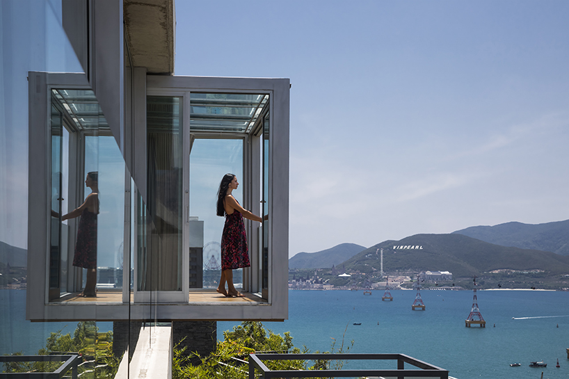 MM++ architects' villa in vietnam uses retractable glass loggia for unique ocean view