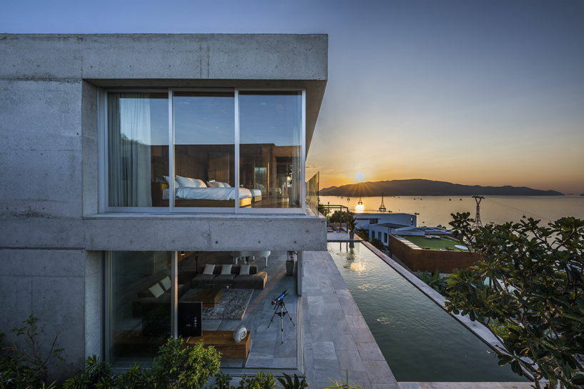 MM++ architects' villa in vietnam uses retractable glass loggia for unique ocean view