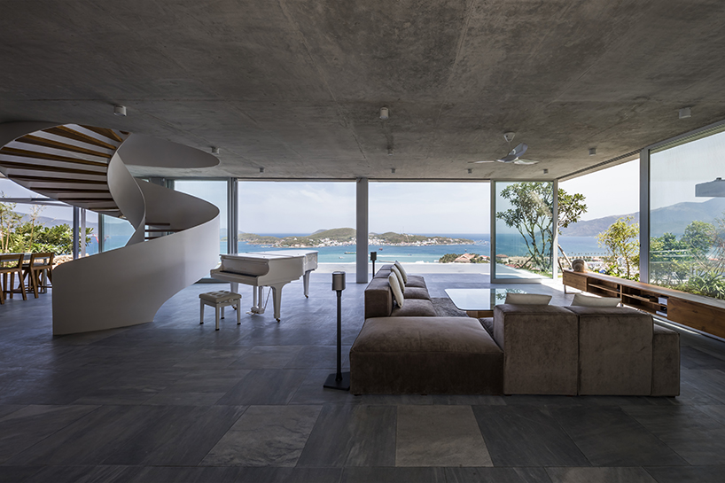 MM++ architects' villa in vietnam uses retractable glass loggia for unique ocean view