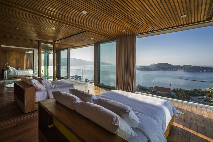 MM++ architects' villa in vietnam uses retractable glass loggia for unique ocean view