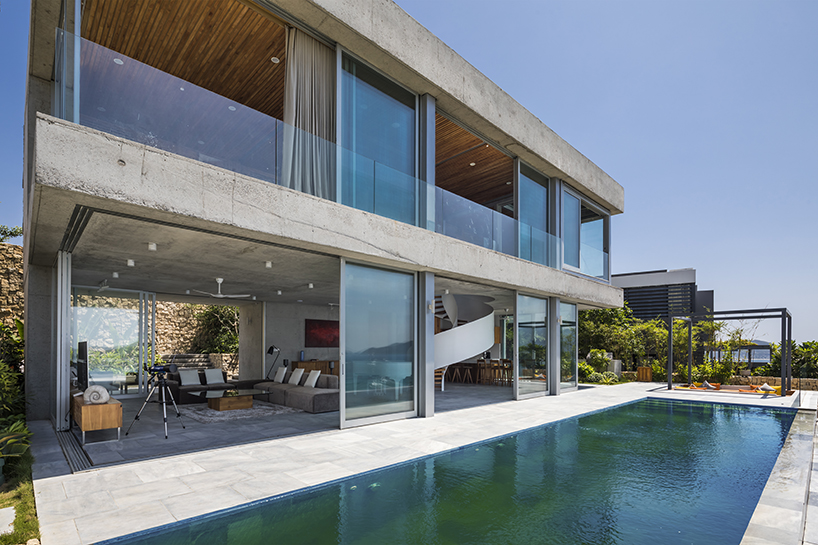 MM++ architects' villa in vietnam uses retractable glass loggia for unique ocean view