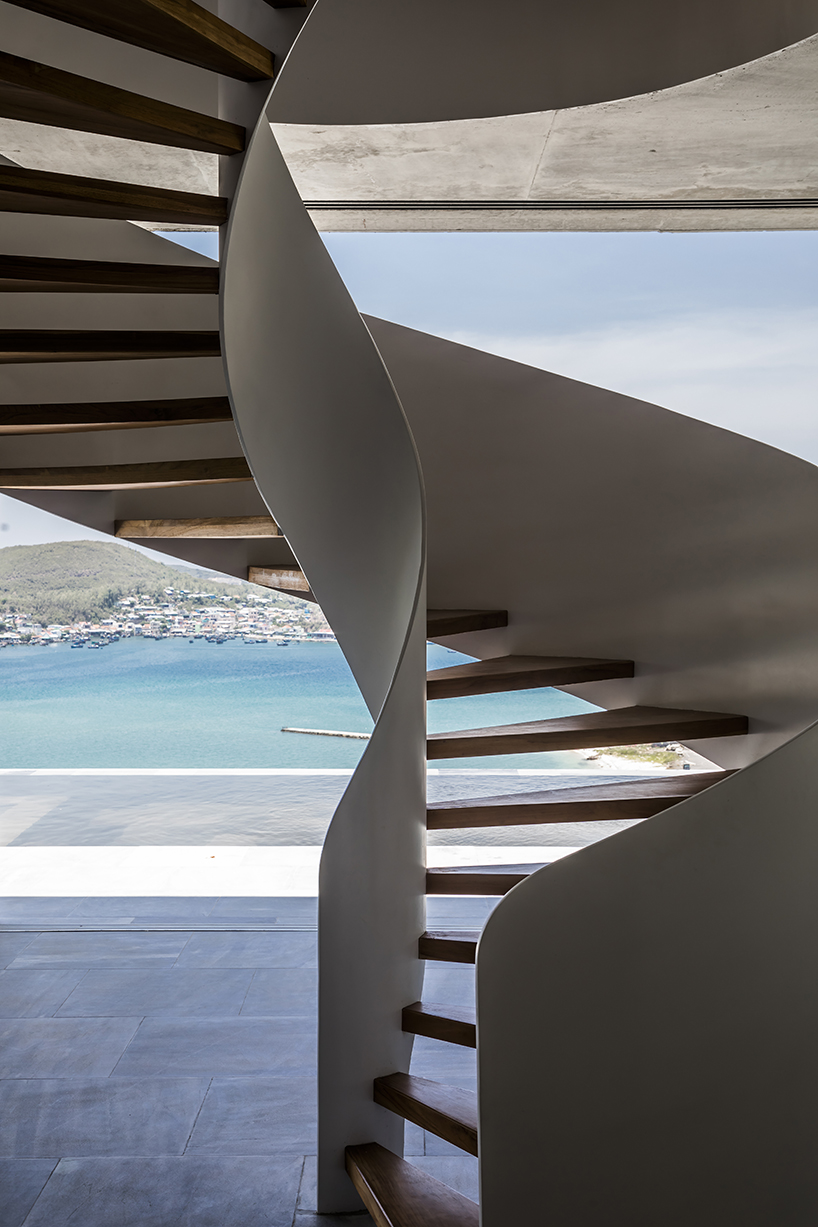 MM++ architects' villa in vietnam uses retractable glass loggia for unique ocean view