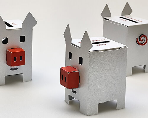 metallic piggy bank made of paper encourages young people to save money and donate