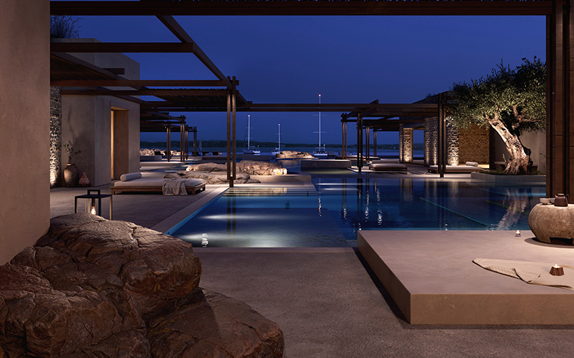 beach club’s stepped stone volumes and timber pergolas surround lagoon-like pool in greece - 7