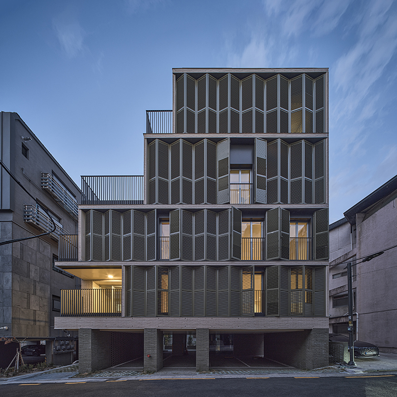 daniel valle architects' staggered villa stands out from restricted urban mass of seoul 