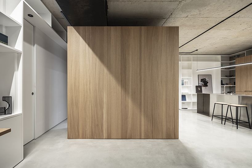 toledano + architects organizes this tel aviv loft around a stainless steel and wood cube designboom
