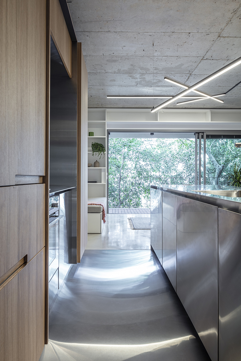 toledano + architects organizes this tel aviv loft around a stainless steel and wood cube designboom