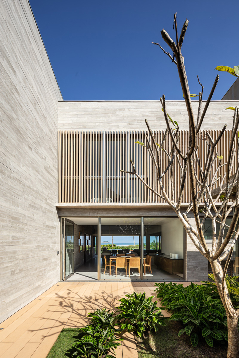 basiches arquitetos integrates outdoor spaces in the renovation of MF house in são paulo designboom
