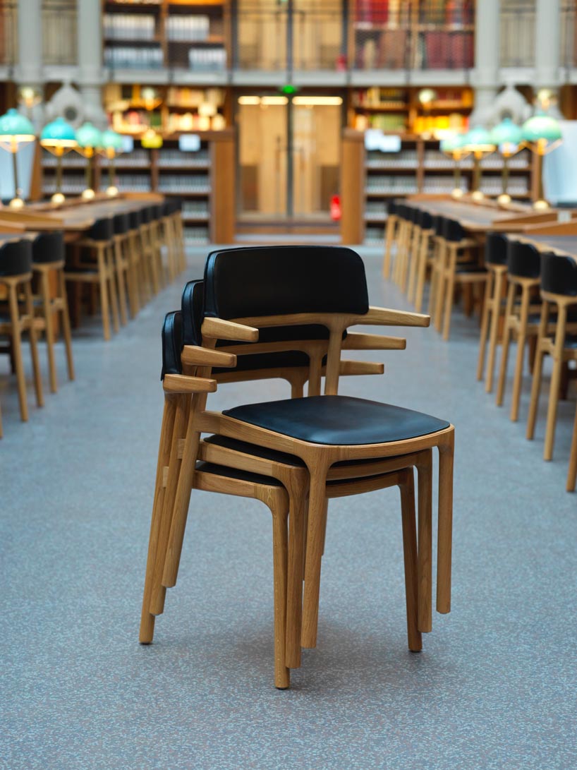 patrick jouin and alki furnish national library of france with discreet wooden 'orria' chairs