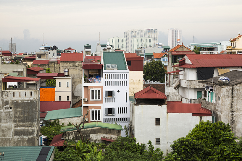 moon house by nh village in vietnam stands out from the surroundings with its futuristic façade designboom