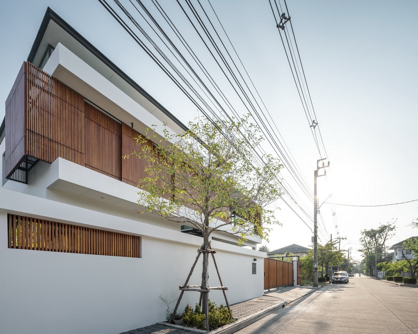 bangkae house by archimontage uses wooden sliding panels to maintain privacy