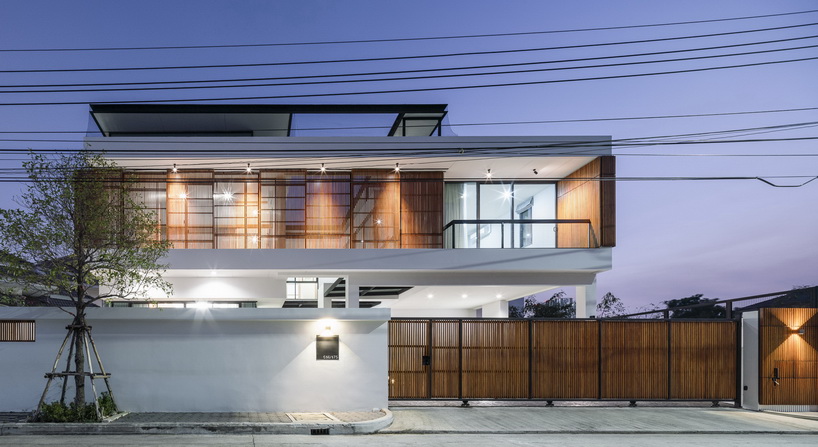 bangkae house by archimontage uses wooden sliding panels to maintain privacy