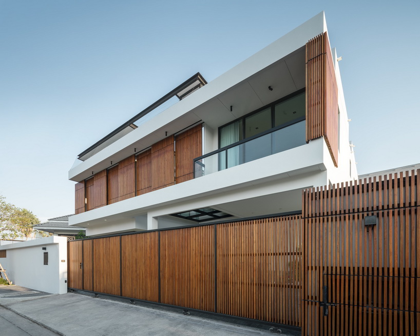 bangkae house by archimontage uses wooden sliding panels to maintain privacy