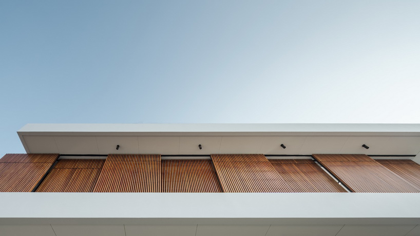 bangkae house by archimontage uses wooden sliding panels to maintain privacy