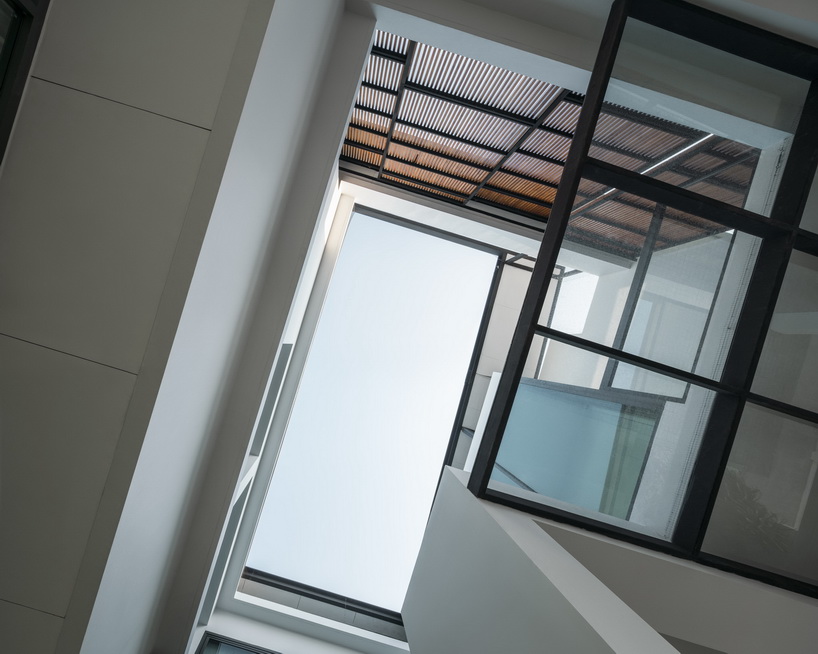 bangkae house by archimontage uses wooden sliding panels to maintain privacy