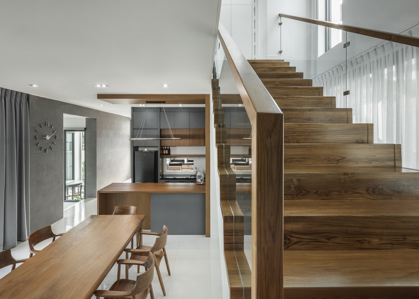 bangkae house by archimontage uses wooden sliding panels to maintain privacy