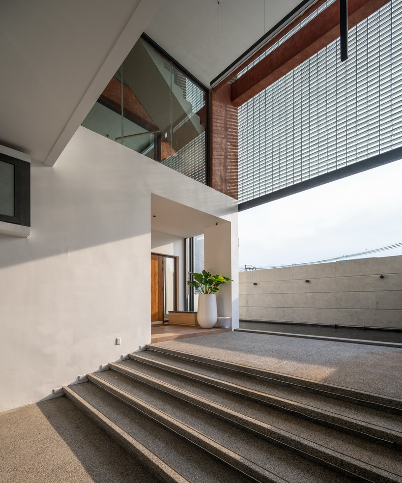 glass block walls bring natural light into archimontage's sena house in bangkok designboom