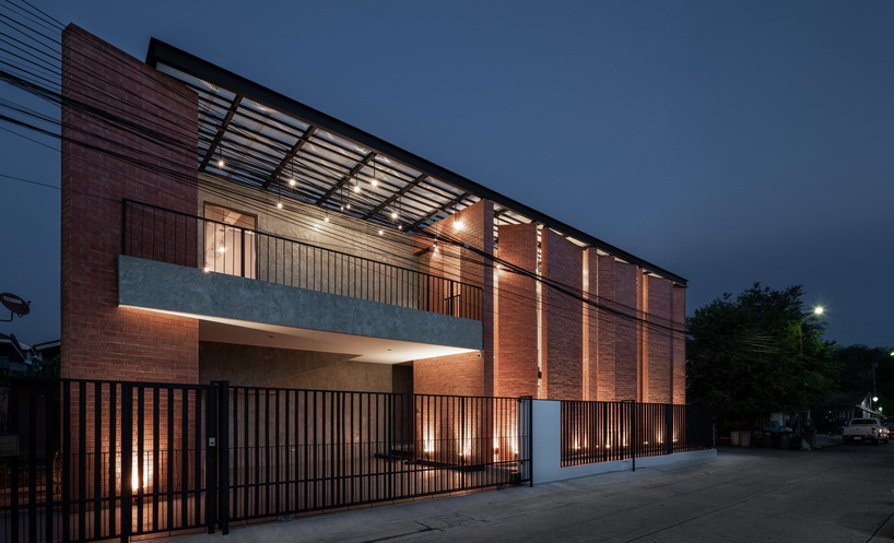 a wall of terracotta tiles shield archimontage's pakkret house in thailand designboom