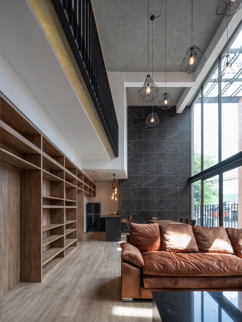 a wall of terracotta tiles shield archimontage's pakkret house in thailand designboom