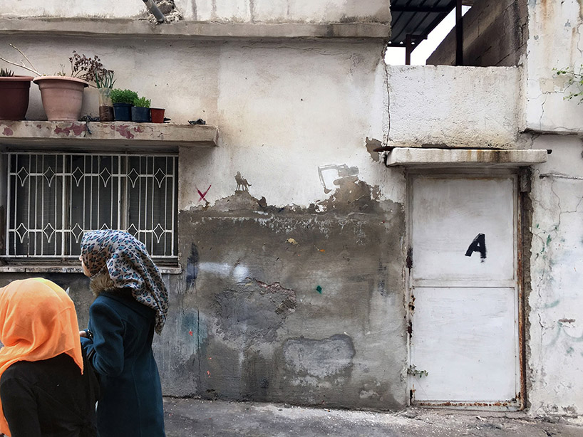 pejac wall peelings palestinian refugee camp jordan designboom